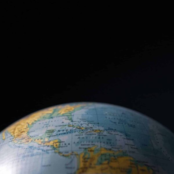 Focused image of a globe highlighting Cuba and Central America with a dark background. Daily devotion