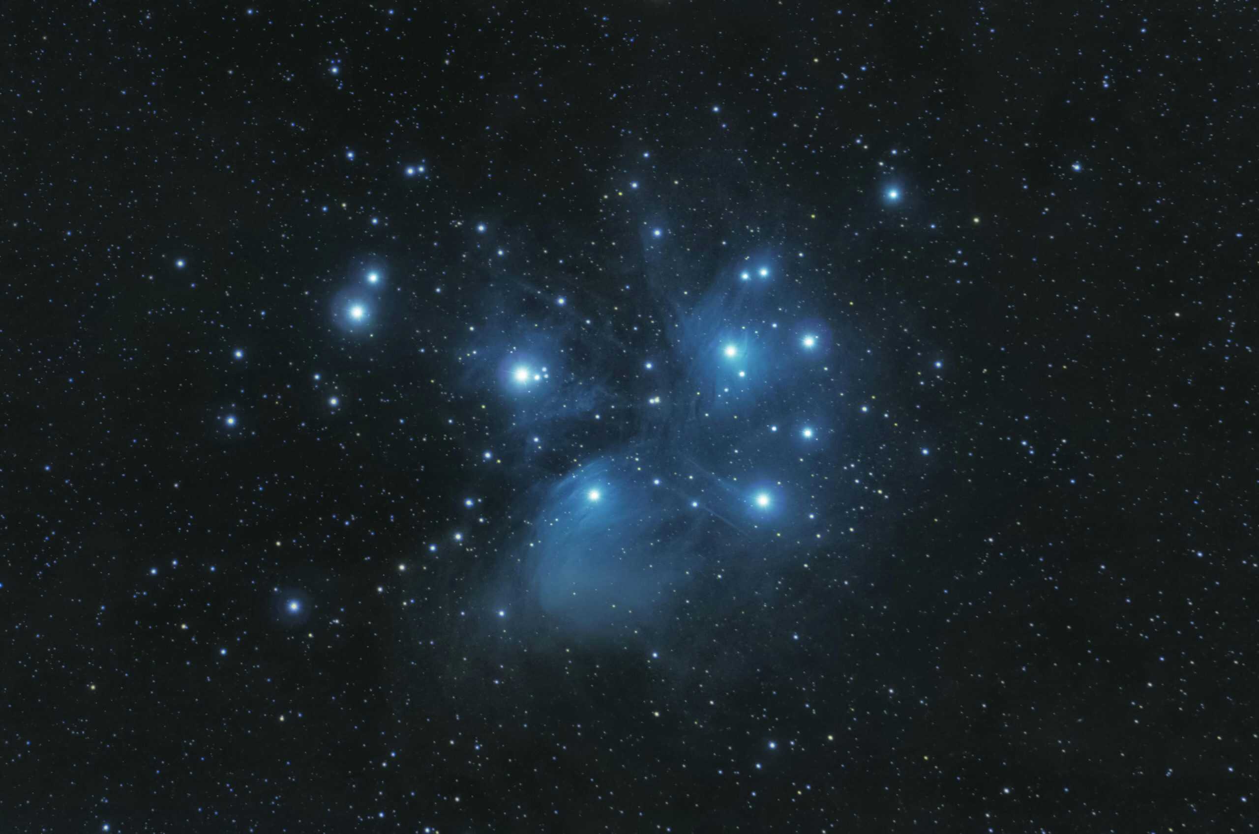 Captivating image of the Pleiades star cluster against a starry night sky.