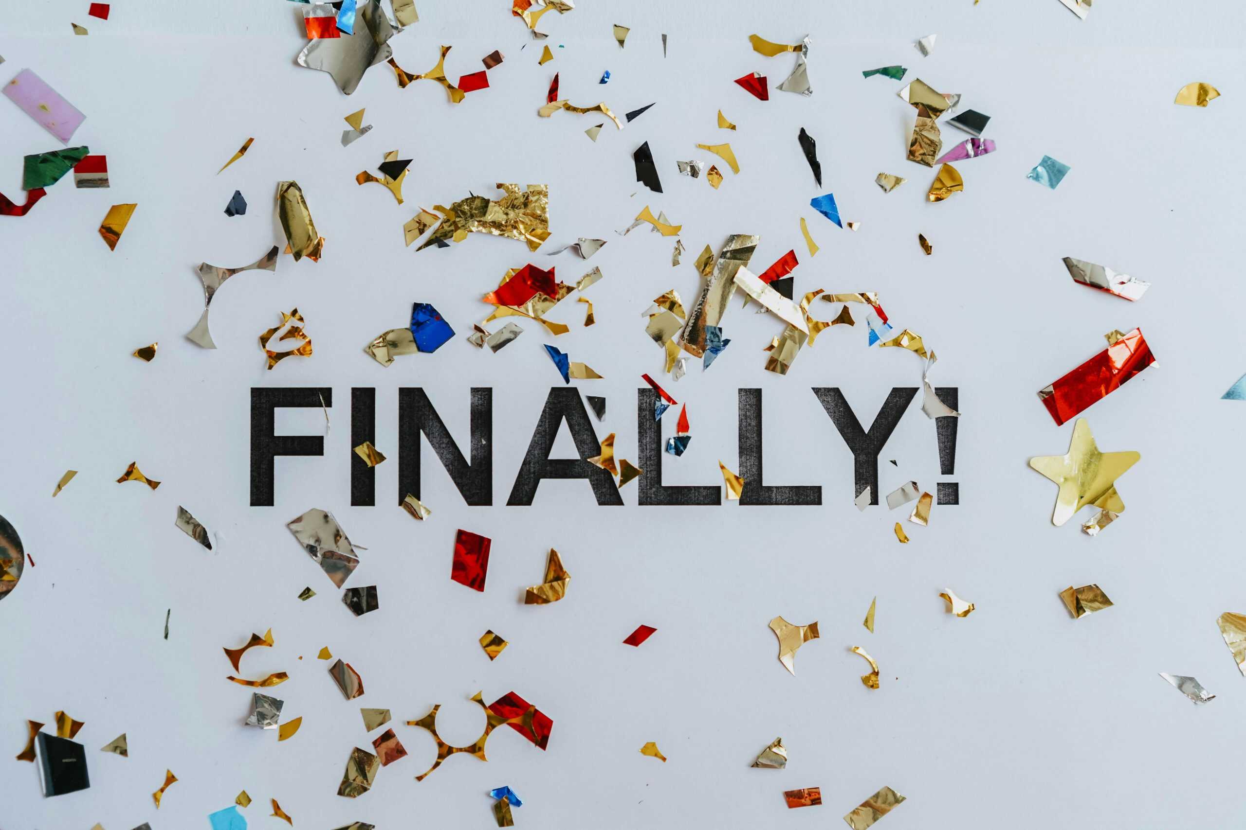 Colorful confetti scattered over the word 'Finally' symbolizing celebration or achievement. daily devotion