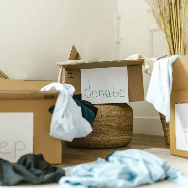 Cardboard boxes labeled keep, donate, and trash for effective home organization. declutter