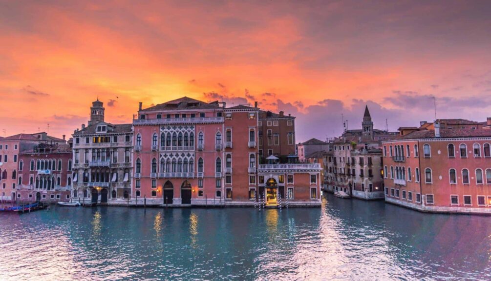 This image is of the Grand Canal in Venice at sunset. Venice can be included in a discussion of culinary spots in Italy.