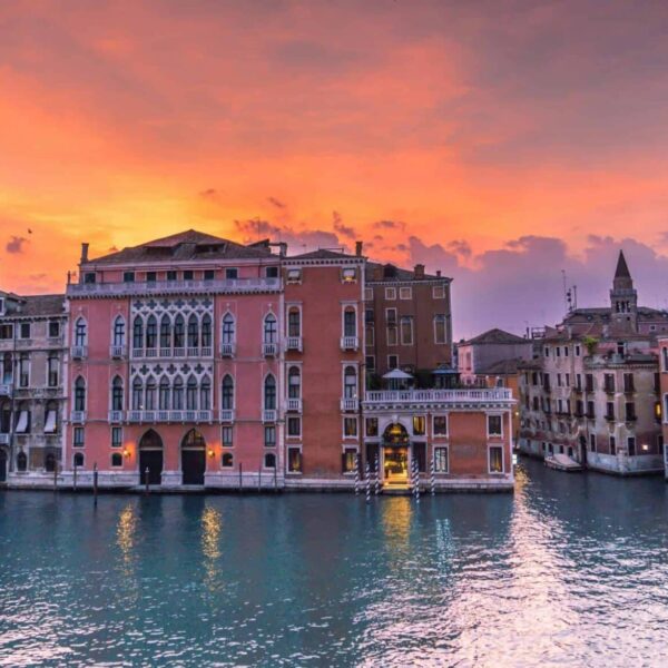 This image is of the Grand Canal in Venice at sunset. Venice can be included in a discussion of culinary spots in Italy.