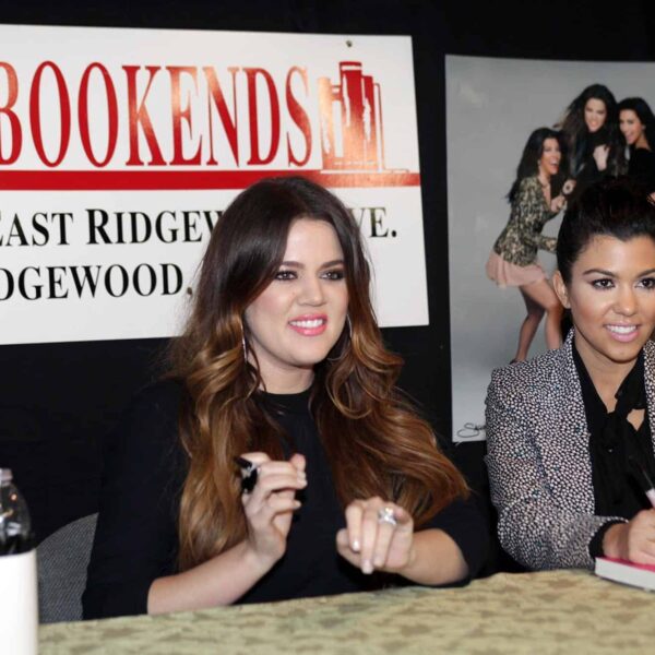 Khloe and Kourtney Kardashian (L-R) pose for photos as they arrive for their book signing Wednesday evening at Bookends in Ridgewood, November 16, 2011.