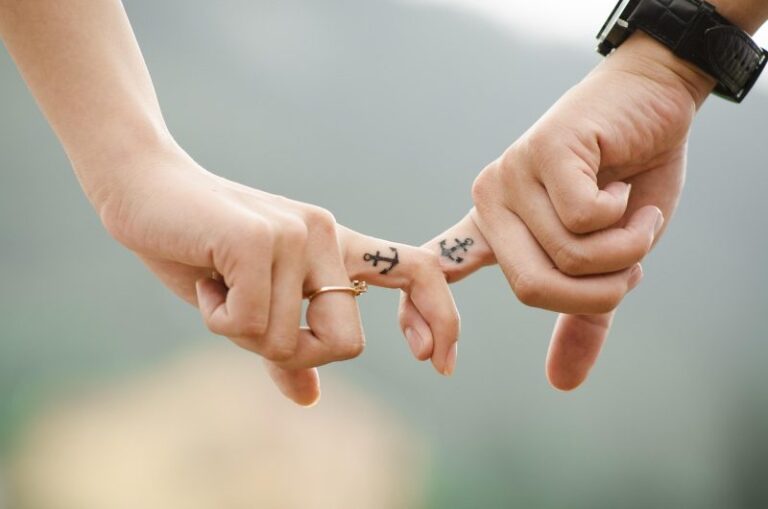 mental health in relationships, valentines day background, couple, hands, tattoos, fingers, intertwined, anchor tattoos, lovers, together, touch, relationship, closeup