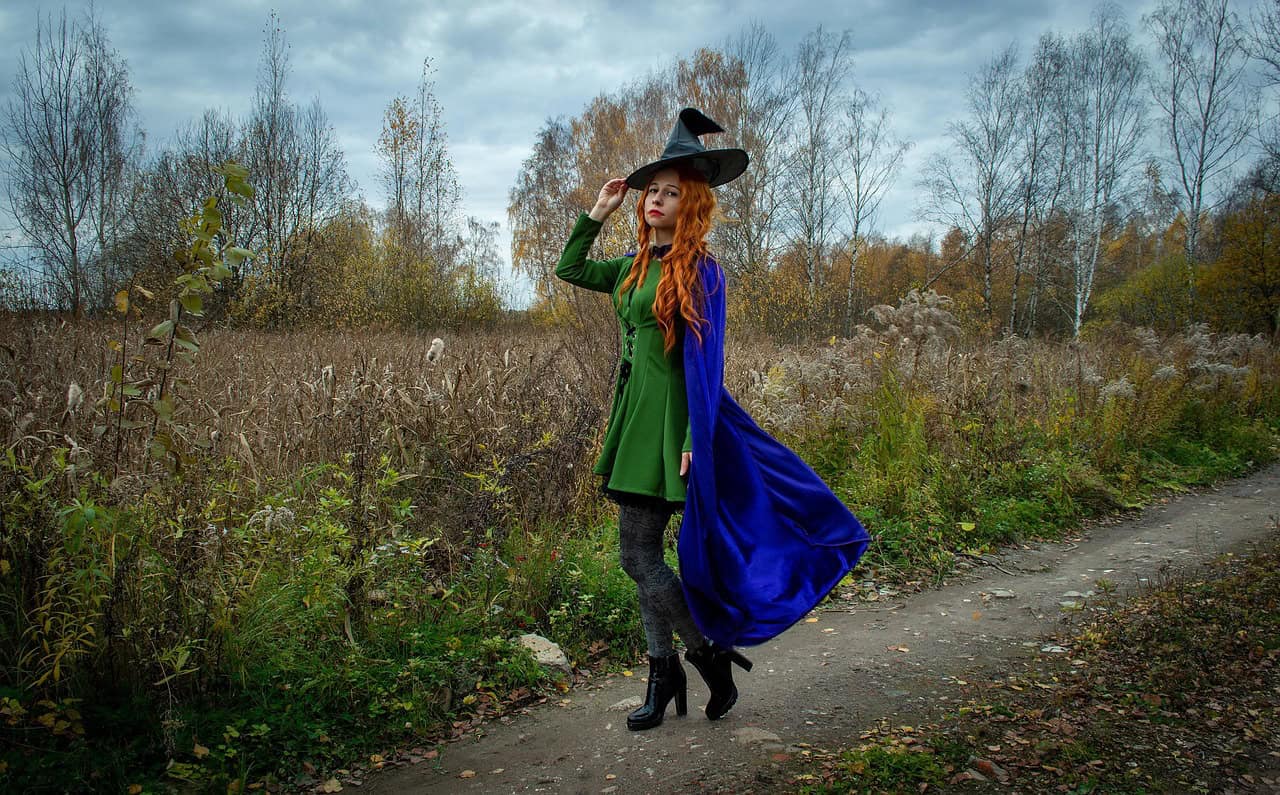 witch, nature, halloween, road, field, grass, forest, thicket, sight, redhead, fantasy, autumn, image, cosplay, magic, young woman, woman, raincoat, cap, witch hat, witch's cap