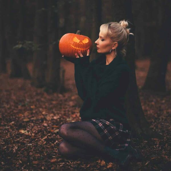 woman in black sweater holding pumpkin, Sexy Halloween Costume