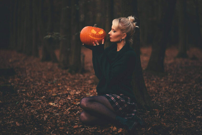 woman in black sweater holding pumpkin, Sexy Halloween Costume