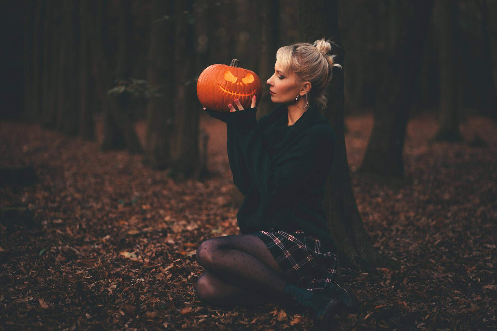 woman in black sweater holding pumpkin, Sexy Halloween Costume