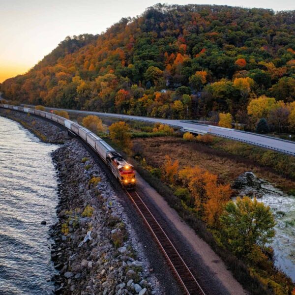 fall colors, A scenic autumn train ride along a lake in Reads Landing, Minnesota, surrounded by vibrant fall foliage.