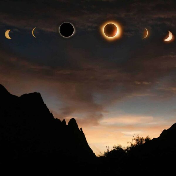 Sequence of solar eclipse phases captured over the dramatic silhouette of Lerdo, Mexico at sunset.