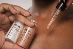 A detailed view of primer being applied to skin with a dropper. hydrating primers, mature skin