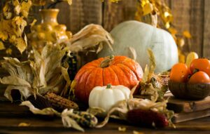 Still life of pumpkins and gourds with autumn leaves, capturing the essence of fall. autumn centerpieces, table centerpieces