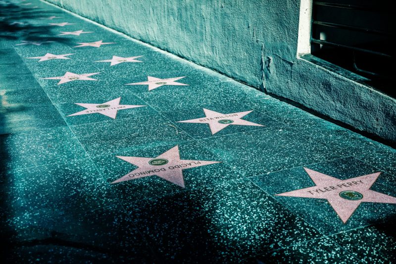 View of Hollywood Walk of Fame with stars on the sidewalk in Los Angeles, California.