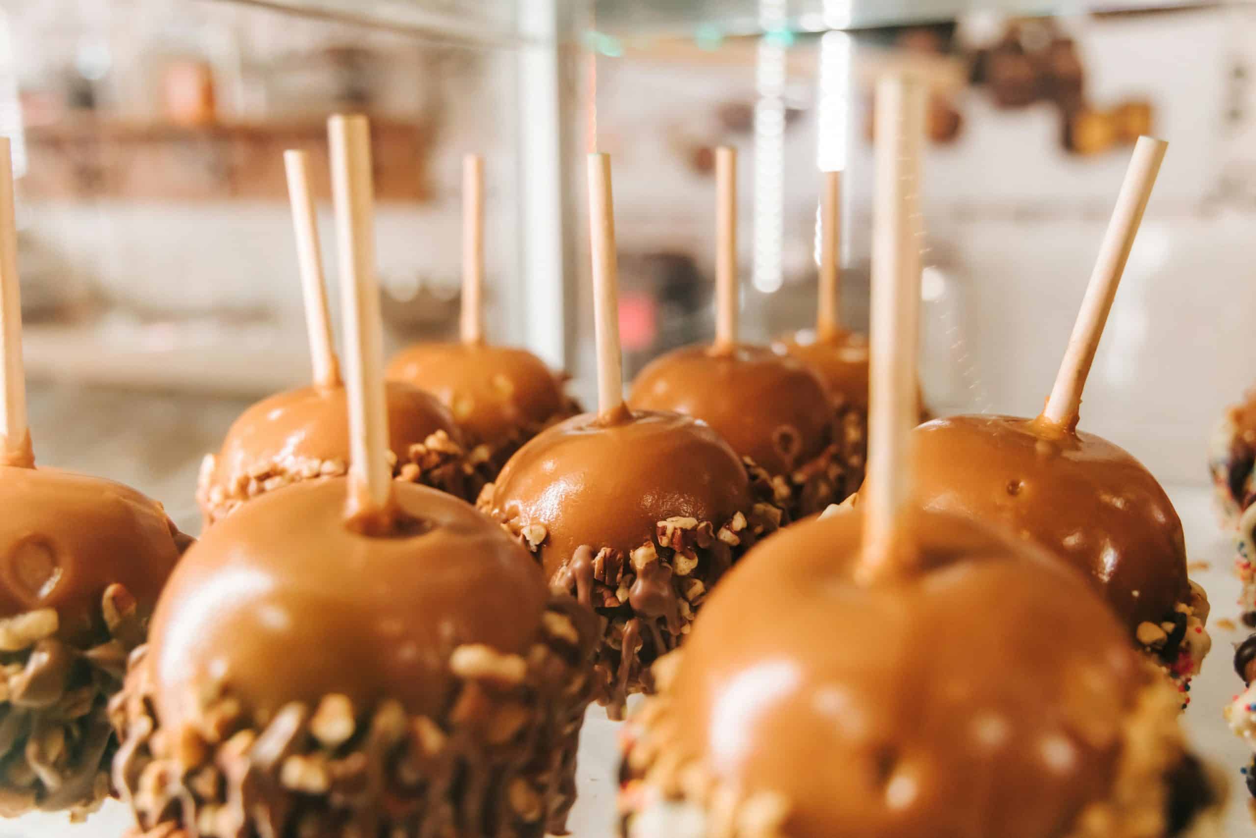 Close-up of caramel apples with nuts on display in San Antonio.