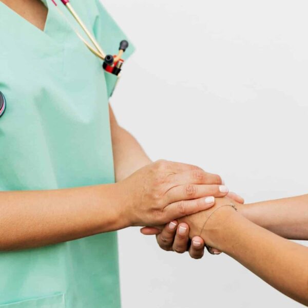 Close-up of a doctor holding a patient's hands, symbolizing trust and empathy in healthcare. advocating, chronic illness, advocate