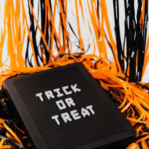 Trunk or Treat, Trick or Treat, A festive Halloween sign displaying 'Trick or Treat' surrounded by orange and black ribbons.