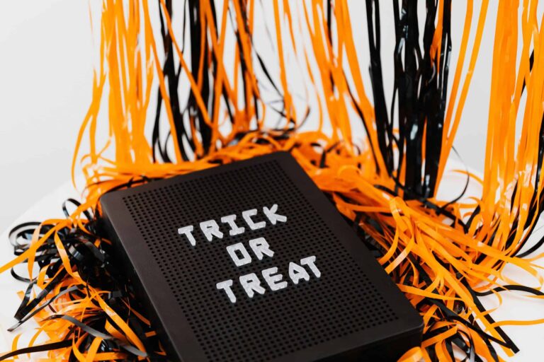 Trunk or Treat, Trick or Treat, A festive Halloween sign displaying 'Trick or Treat' surrounded by orange and black ribbons.