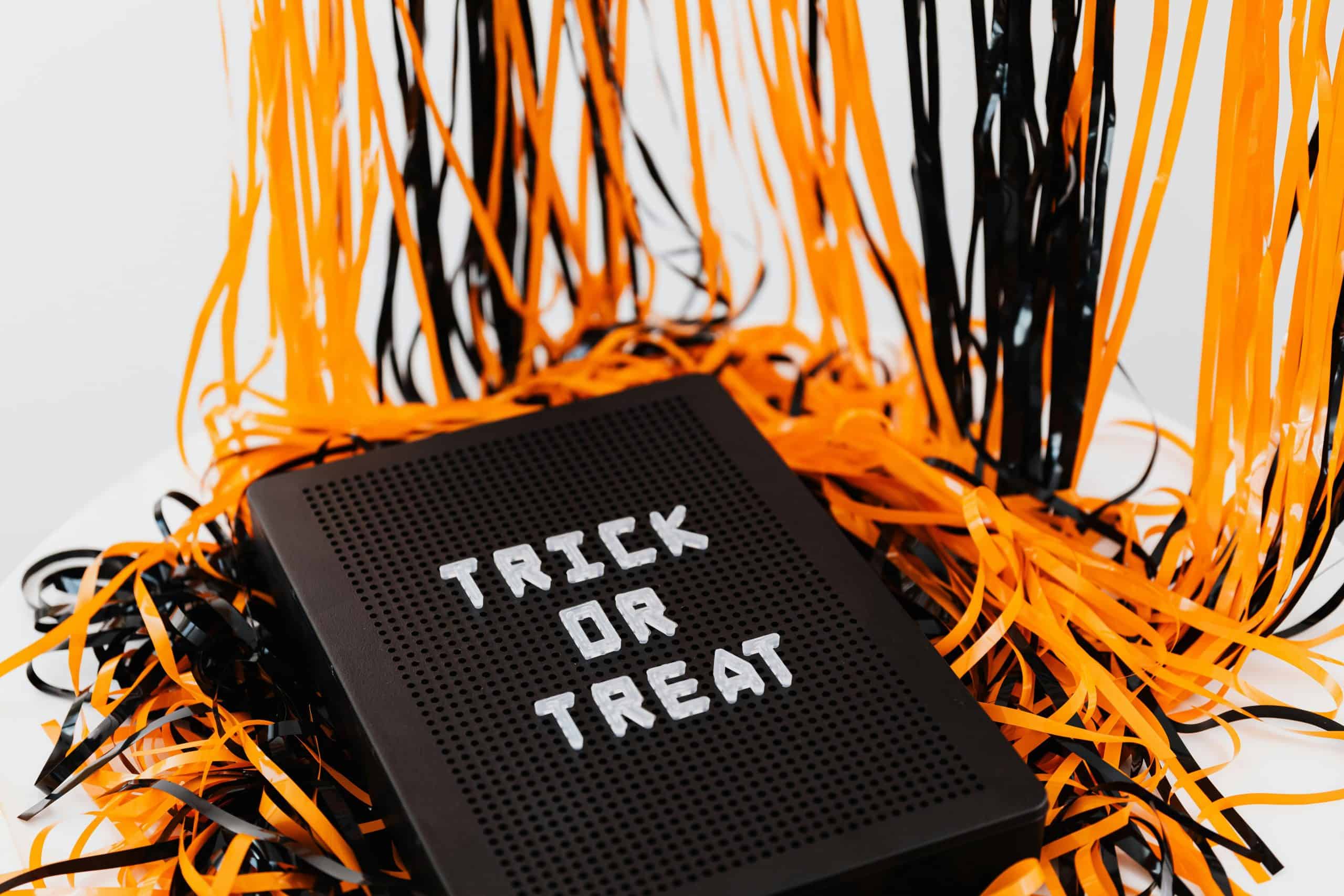 Trunk or Treat, Trick or Treat, A festive Halloween sign displaying 'Trick or Treat' surrounded by orange and black ribbons.