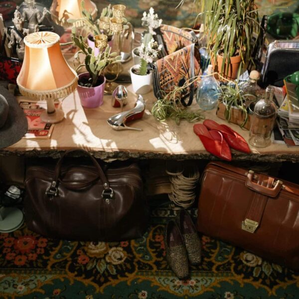 red flags, thrifting, A warm, cluttered secondhand store with vintage items and eclectic antiques on display.