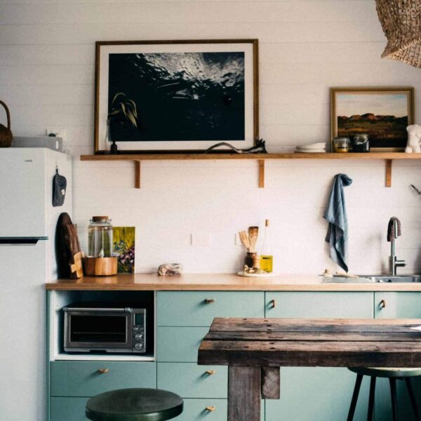 This photograph features a kitchen with wood incorporated into the decor. Wood countertops can work well as part of a variety of kitchen looks.