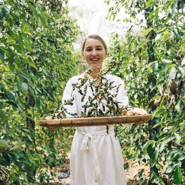 A joyful woman harvesting fresh peppercorns on a sunny day on the farm biblical teachings