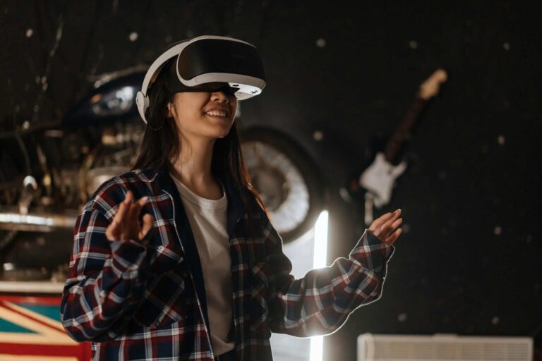Phygital, Young woman immersed in virtual reality using a VR headset, enjoying a digital world indoors.