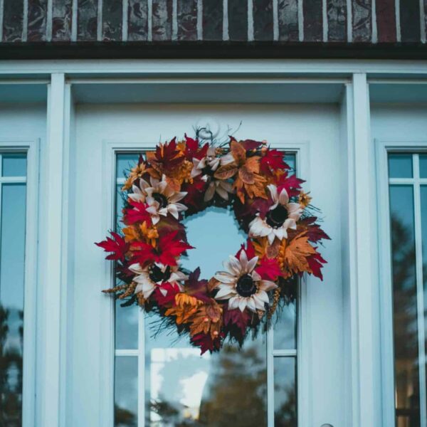 Colorful autumn wreath on a front door, capturing fall's festive charm. fall wreath
