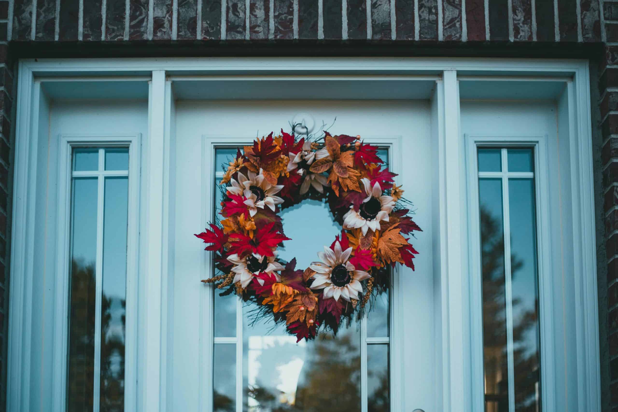 Colorful autumn wreath on a front door, capturing fall's festive charm. fall wreath