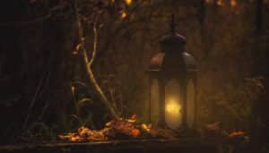Autumn Equinox, release, yellow pillar candle in black lantern