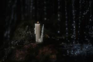 a candle on a rock, Samhain