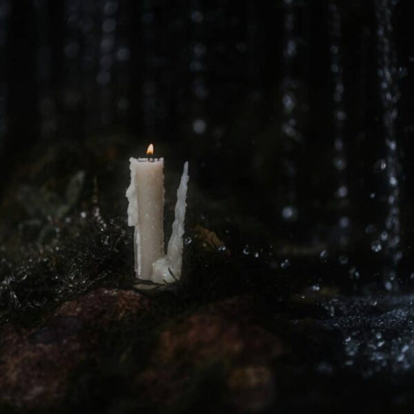 a candle on a rock, Samhain