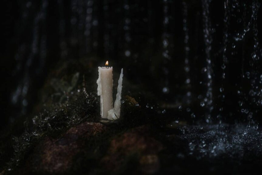 a candle on a rock, Samhain