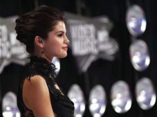 This is a photograph of Selena Gomez. Her makeup look for lips and cheeks from her wedding is available.