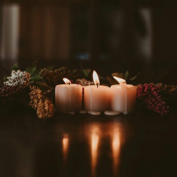 white candles on brown wooden table, making your own