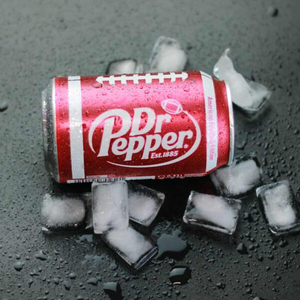 a can of soda sitting on top of ice cubes, whipped dr pepper, viral drink,