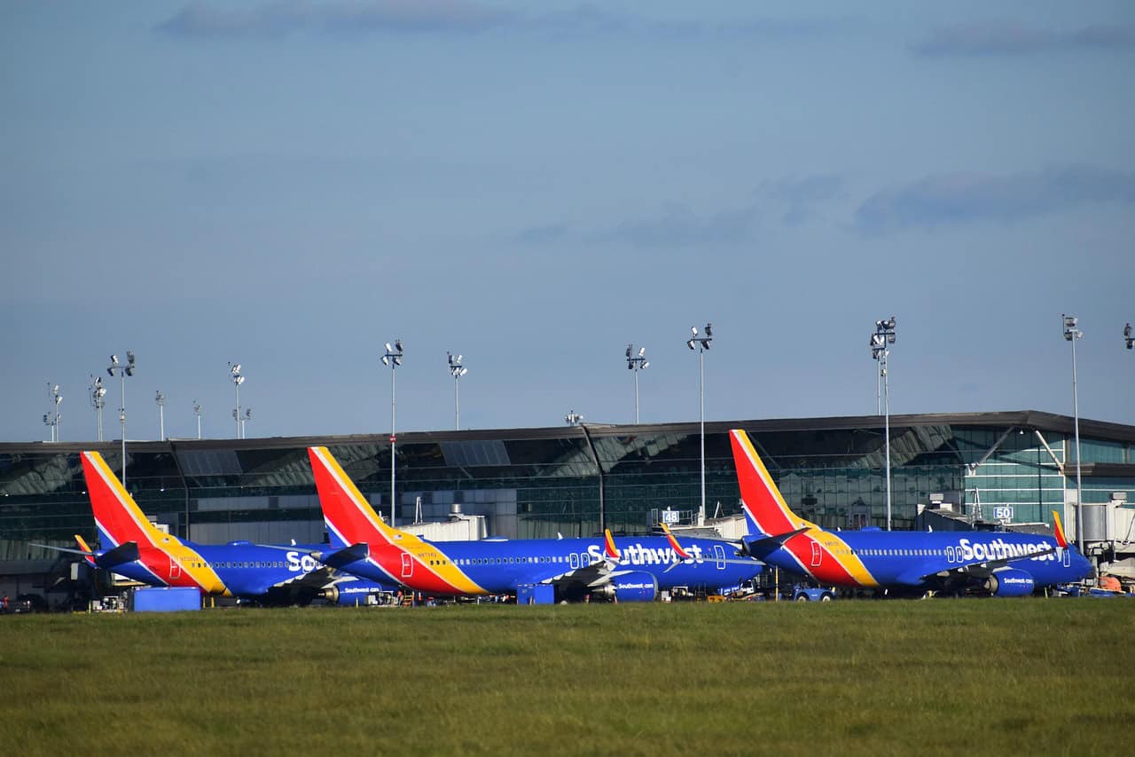 This is a photograph of Southwest Airlines planes. Southwest offers new travel possibilities for summer 2026.
