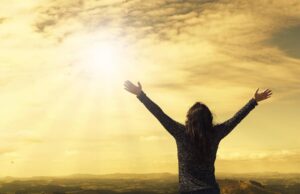 woman, sky, sunlight, arms, open arms, sunbeams, sunrays, clouds, worship, freedom, happiness, relieved, prayer, praise, success, nature, joy, daily devotion
