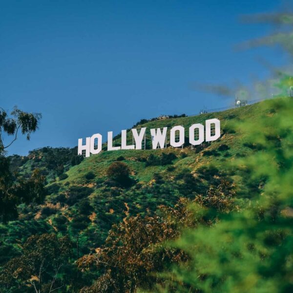 A scenic view of the famous Hollywood sign on a sunny day in Los Angeles.