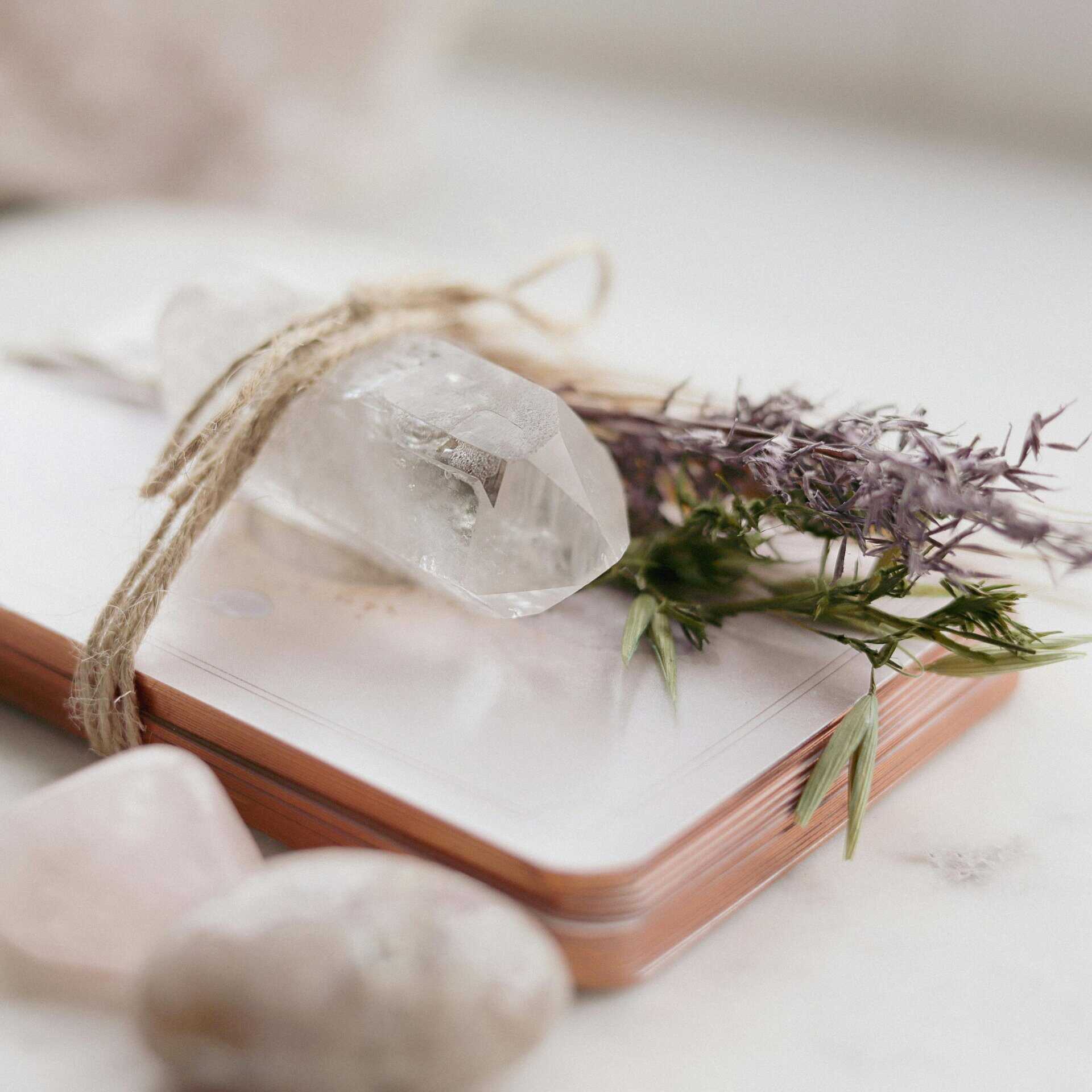 A serene composition of a quartz crystal, lavender, and spiritual cards for meditation. Focusing on Aquarian weekly forecasts. 