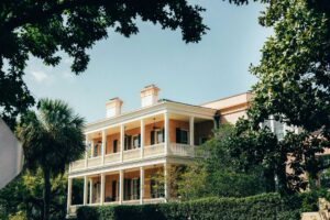 Charming historic Southern mansion surrounded by lush greenery in Savannah, Georgia.