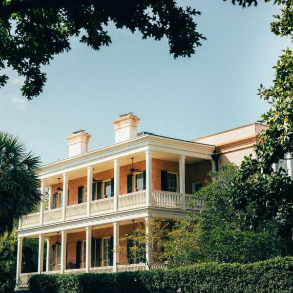 Charming historic Southern mansion surrounded by lush greenery in Savannah, Georgia.