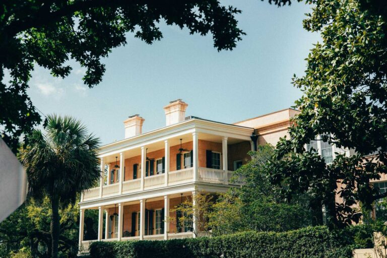 Charming historic Southern mansion surrounded by lush greenery in Savannah, Georgia.