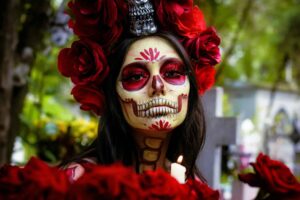 Colorful Catrina makeup portrait in a Mexican cemetery for Day of the Dead celebration, Mexico City