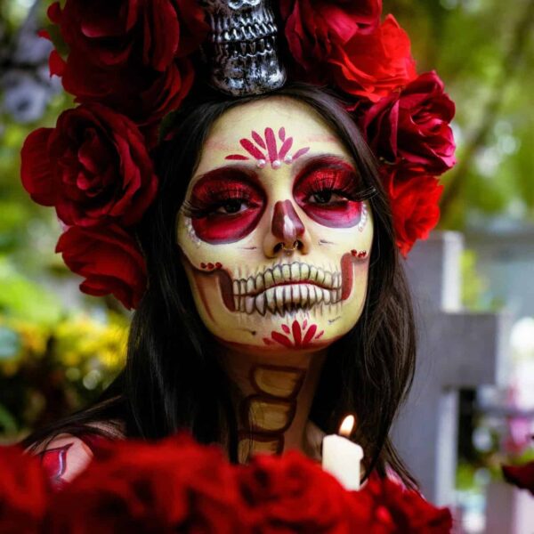 Colorful Catrina makeup portrait in a Mexican cemetery for Day of the Dead celebration, Mexico City