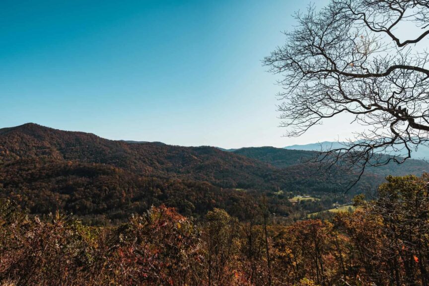 Captivating panoramic view of the Blue Ridge Mountains in Asheville during autumn with vibrant foliage.