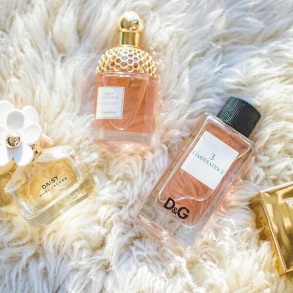 Elegant collection of perfume bottles on soft fur, highlighting luxury and style. Walmart deals on perfume.