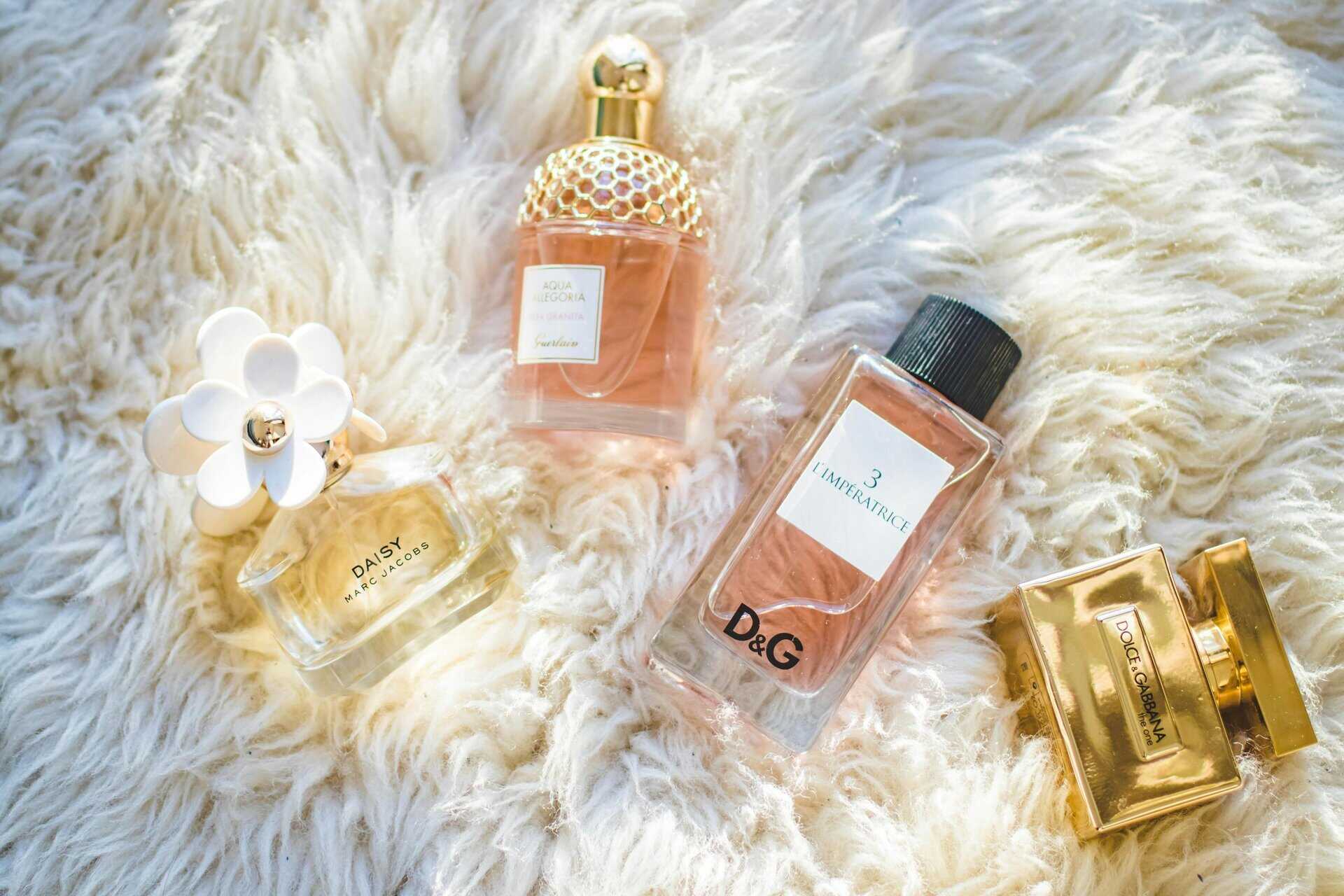 Elegant collection of perfume bottles on soft fur, highlighting luxury and style. Walmart deals on perfume.