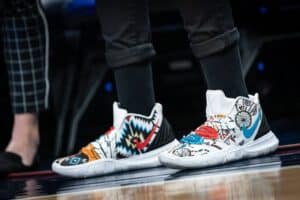 This photograph features shoes worn by Seimone Augustus customized for Native American Heritage Night. The shoes are decorated with Native American motifs. Native American designers are being highlighted this year., Indigenous