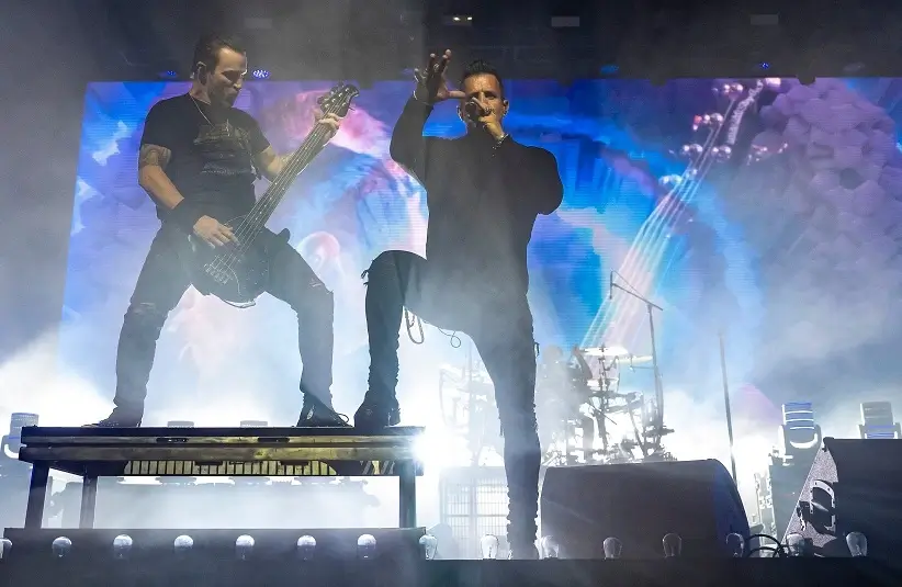 Bassist Brian Marshall (left) and lead vocalist Scott Stapp of Creed perform alongside one another during their late-night set in the Palomino tent at Stagecoach country music festival in Indio, Calif., Saturday, April 26, 2025.