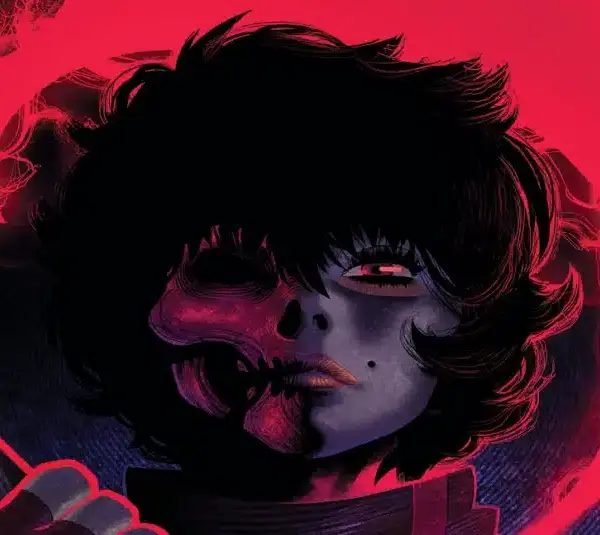 Stylized cover art from Boom Studios’ “Grim,” showing a figure with half a human face and half a glowing skull in red light.
